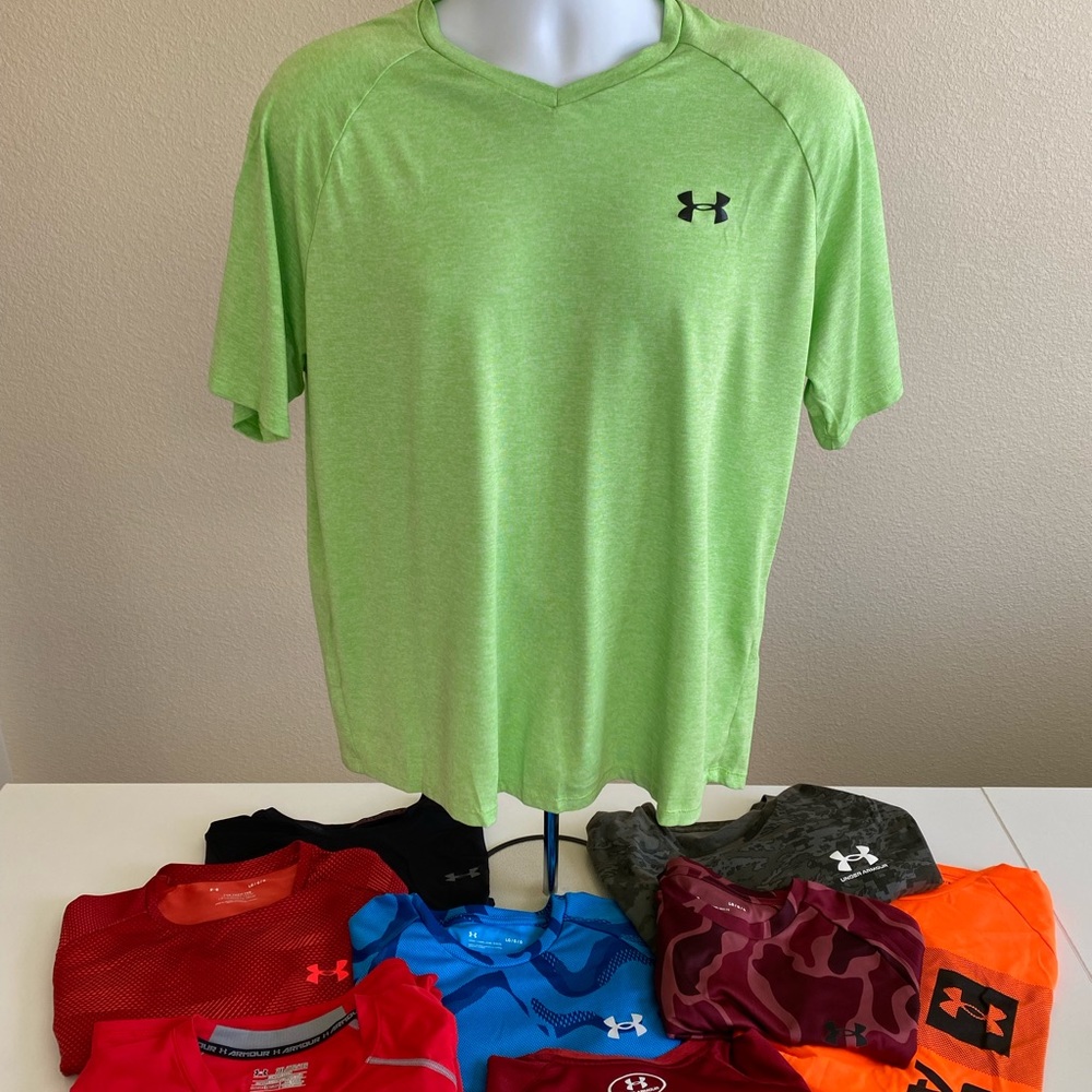 8 Under Armour workout shirts. Red shirt is free and is a 2XL compression shirt